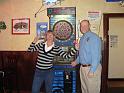 Angie beats up on Randy at a friendly game of darts!